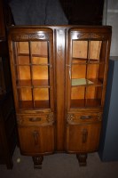 Lot 923 - A 1930's oak bookcase with two glazed panelled...