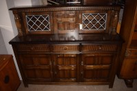 Lot 924 - A 20th Century oak sideboard, two lead glazed...