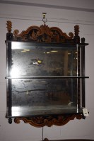 Lot 940 - An ebonised three-tier wall mounted shelf unit...