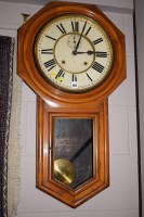 Lot 960 - An American wall clock stained wood case cream...