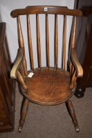 Lot 966 - Ibex rocking chair with spindle back, shaped...