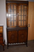 Lot 968 - An early 20th Century oak bookcase with two...