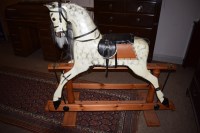 Lot 970 - A modern large dapple grey rocking horse on...