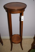 Lot 983 - An early 20th Century walnut two-tier plant...