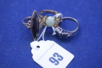 Lot 93 - A sapphire and diamond ring, on yellow metal...