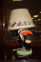 Lot 451 - A Carlton ware Guinness Toucan table lamp with...