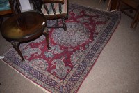 Lot 760 - A 20th Century Kerman Lavar rug on burgundy...