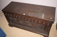 Lot 828 - A 19th Century style oak coffer with carved...