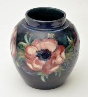 Lot 114 - Moorcroft 'Anemone' jar, with row of...