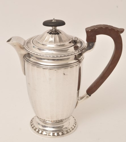 Lot 428 - A George V silver coffee pot, by Barker...