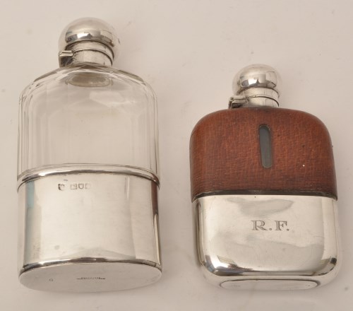Lot 429 - A George V silver mounted glass hip flask, by...