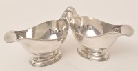 Lot 454 - A pair of George V silver sauce boats, by S.W....