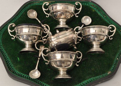 Lot 456 - A set of four George V silver table salts, by...