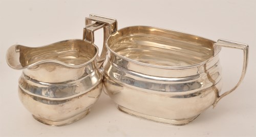 Lot 458 - A George V silver sugar bowl and cream jug, by...
