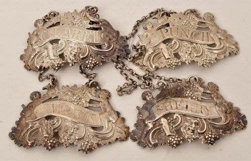 Lot 465 - Four mid 18th Century silver cast wine labels,...