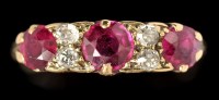 Lot 525 - A ruby and diamond ring, the three graduated...
