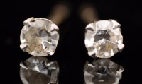 Lot 527 - A pair of diamond stud earrings, each...