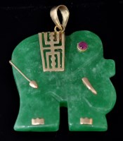 Lot 528 - A Chinese carved jade, ruby and yellow metal...