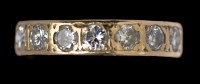 Lot 533 - A seven stone diamond ring, the brilliant cut...