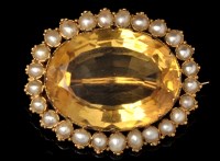 Lot 534 - A citrine and half pearl cluster brooch,...