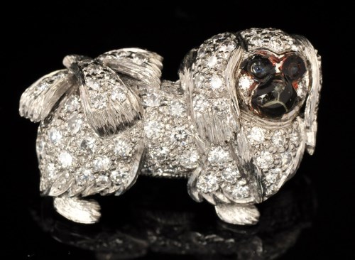 Lot 554 - A diamond and enamel Pekingese pattern brooch,...