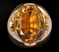Lot 560 - A citrine ring, the oval facet cut citrine...