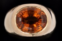 Lot 561 - A citrine ring, the oval facet cut citrine...