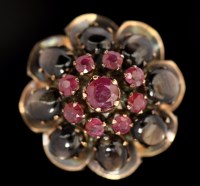 Lot 565 - A ruby and chrysoberyl cluster ring, the...