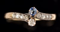 Lot 571 - A sapphire and diamond ring, the principal...