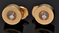 Lot 573 - A pair of Chopard 'Happy Diamond' earrings, in...