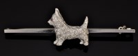 Lot 575 - A diamond set dog pattern brooch, c.1920, the...