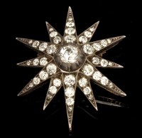 Lot 578 - A Victorian diamond star pattern brooch, the...