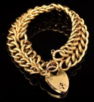 Lot 581 - An Edwardian 9ct. yellow gold bracelet, half...