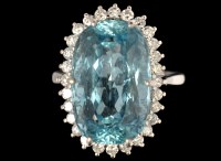 Lot 583 - An aquamarine and diamond cluster ring, the...
