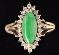 Lot 586 - A jade and diamond cluster ring, the marquise...