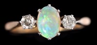 Lot 587 - An opal and diamond ring, the central oval...