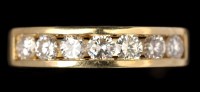 Lot 608 - A seven stone diamond ring, the brilliant cut...