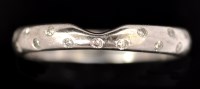 Lot 615 - A diamond wedding ring, set with small...