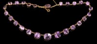 Lot 617 - A Victorian amethyst necklace, the oval facet...