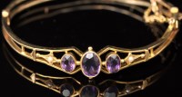 Lot 619 - An Edwardian amethyst seed pearl and yellow...