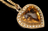 Lot 621 - A citrine and seed pearl heart-shaped pendant,...