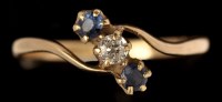 Lot 627 - A sapphire and diamond ring, the two circular...