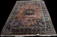 Lot 645 - A Kashan carpet, the blue floral decoration on...