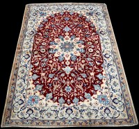 Lot 653 - A Nain rug, the central medallion surrounded...