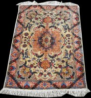 Lot 654 - A Tabriz rug, decorated with floral swags and...