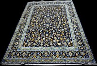 Lot 656 - A Kashan carpet, with bold foliate scrolls on...