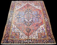 Lot 666 - A Heriz carpet, the central medallion and...