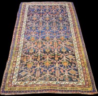 Lot 667 - A Bakhtiari carpet, with panels of flowerheads...