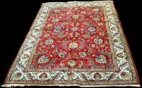 Lot 669 - A Tabriz carpet, the bold floral designs on a...