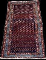 Lot 675 - A Malaya rug, the blue ground decorated with...